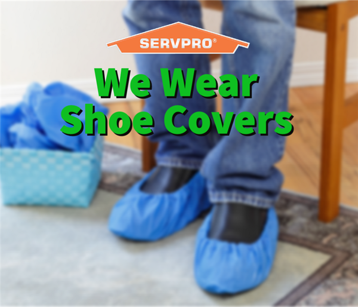 A SERVPRO professional wearing shoe covers in Dayton Ohio.