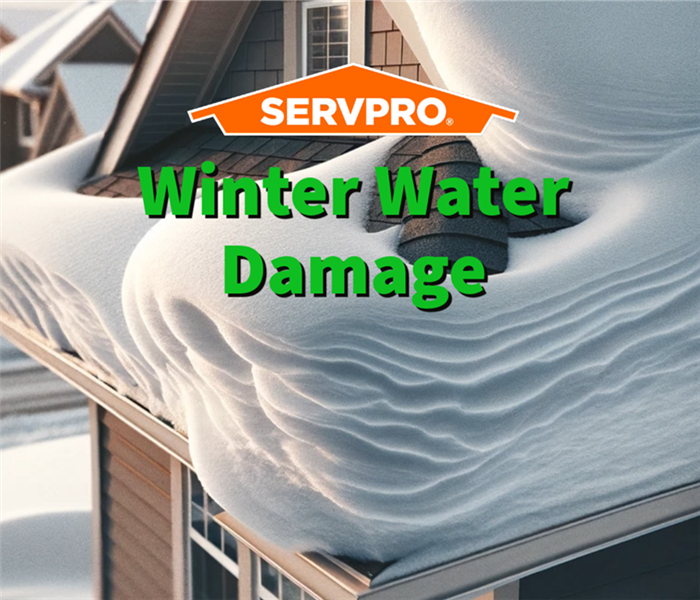 A close-up view of a residential house's roof with a foot of snow on it that caused winter water damage.